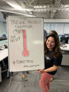 The Planet Group raises money for the Trevor Project with donations shown on white board with red thermometer
