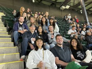 The Planet Group employees sitting in the stands at a Chicago White Sox game